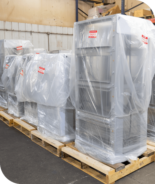 metal pieces stacked and wrapped in plastic wrap ready for assembly