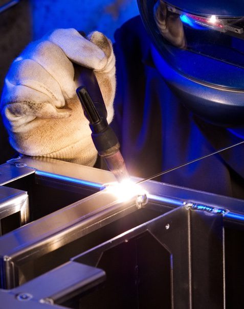 metal worker completing detail welding